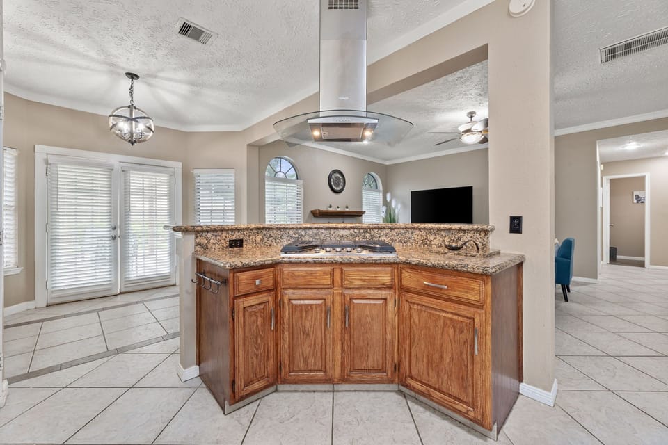 Fully equipped kitchen with modern appliances and Keurig coffee station.