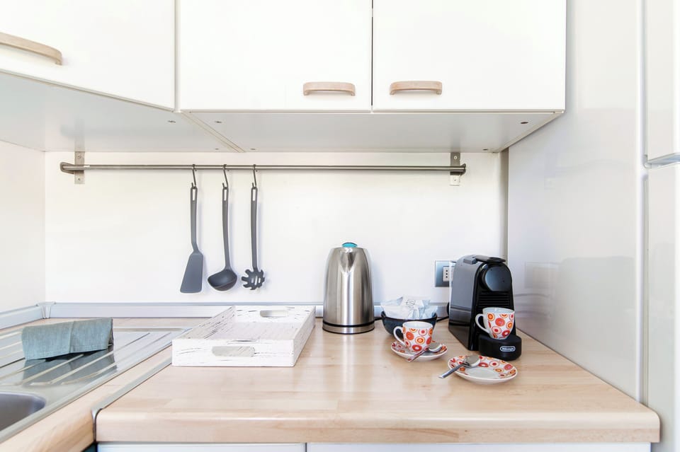 Apartment, Balcony | Private kitchenette | Full-size fridge, oven, stovetop, espresso maker
