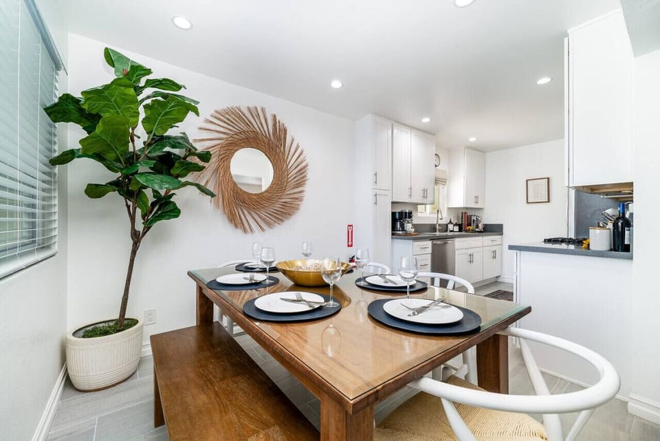 Savor coastal cuisine in style with a seamlessly connected dining room and kitchen