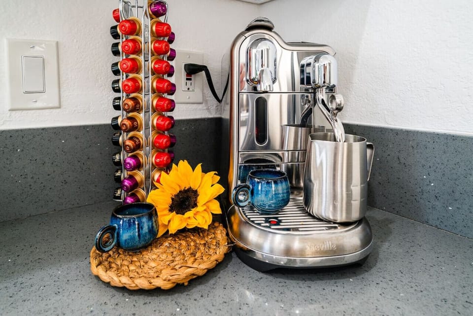 Waking up to fresh espresso from ocean-inspired mugs on your private patio. Enjoy the courtyard view and ocean breeze for a serene start to your day.