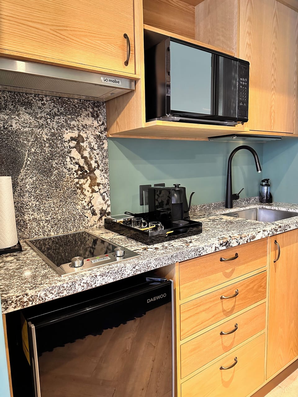 Espresso maker, full-size fridge, microwave, electric kettle