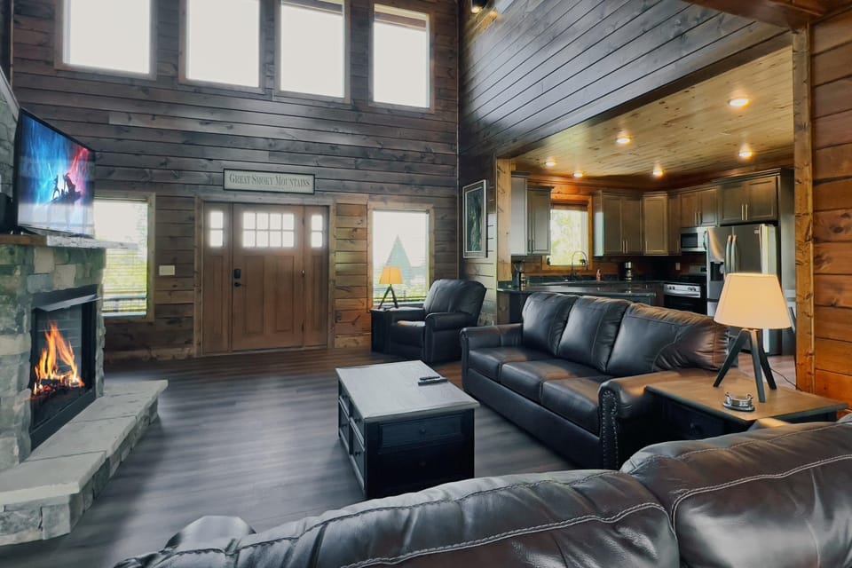 Living room with smart TV and gas fireplace. 