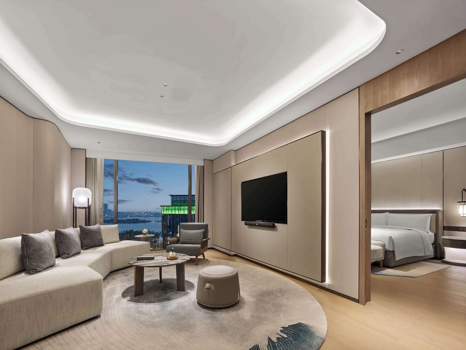 Deluxe Suite, 1 King Bed | Living area | 55-inch LED TV with satellite channels