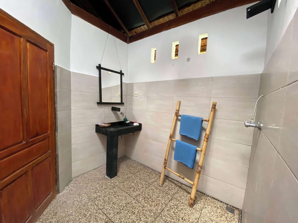 Executive Bungalow, Ocean View | Bathroom | Rainfall showerhead, towels