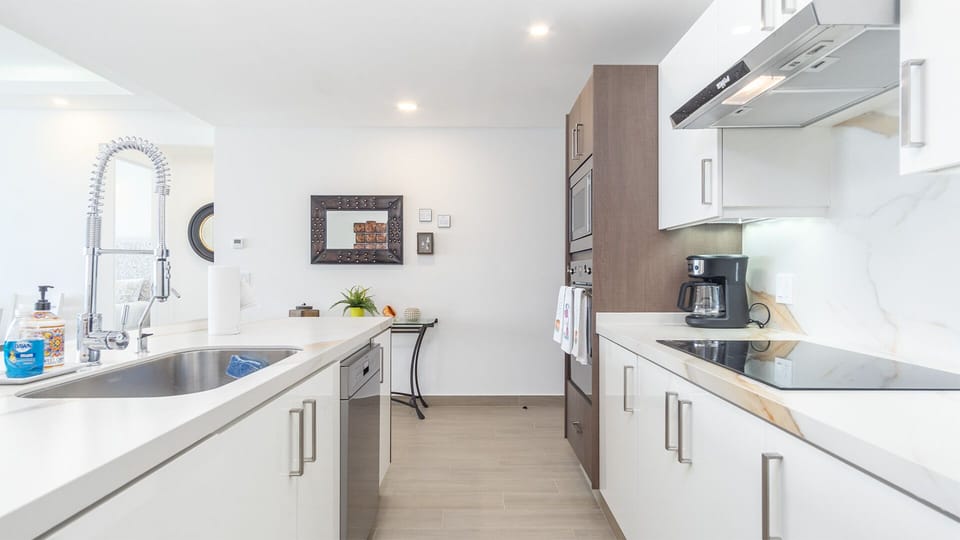 white cabinets, and stainless steel appliances