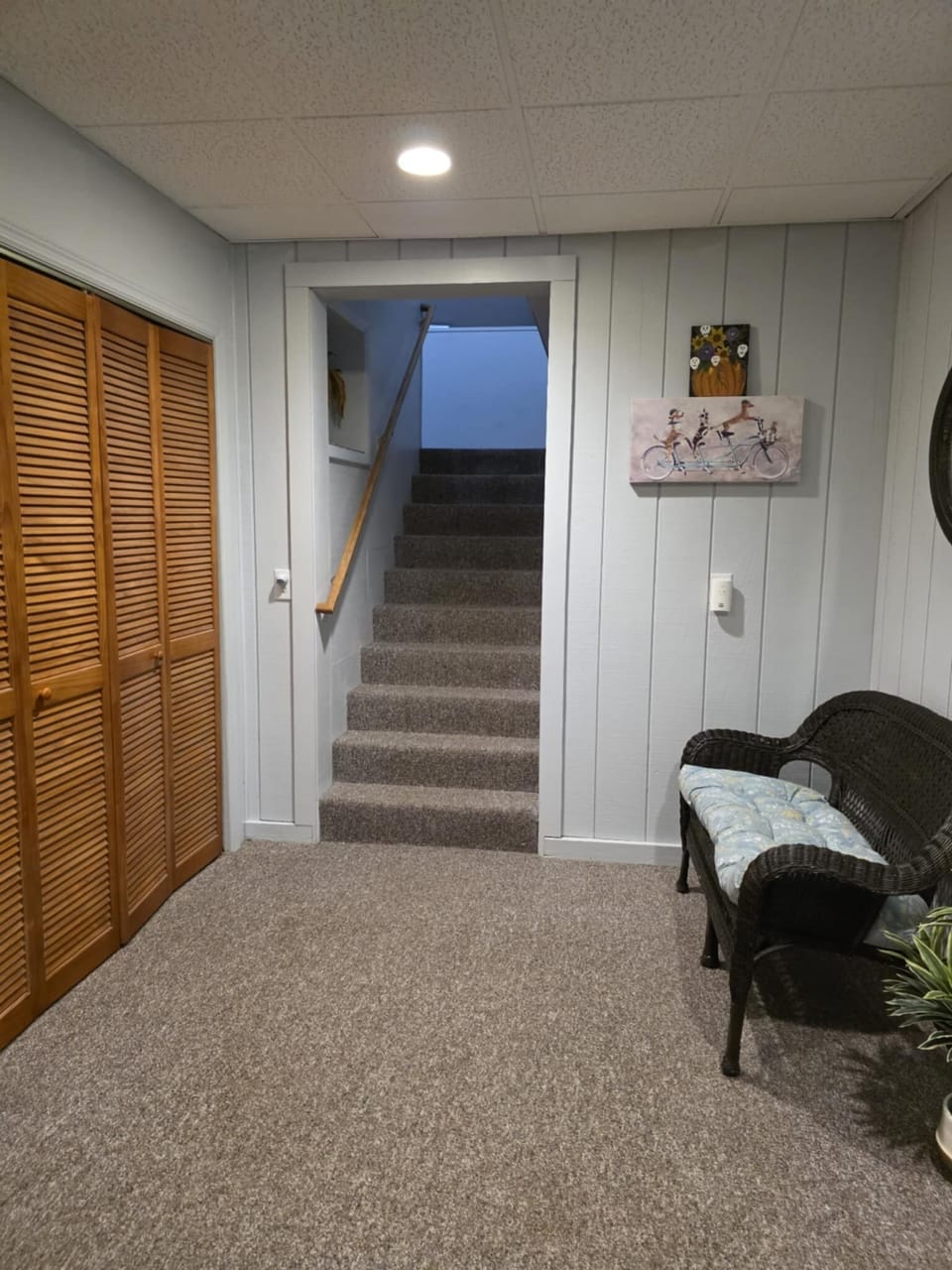 Stairway to upper level where kitchen, bathroom and main bedroom are located.