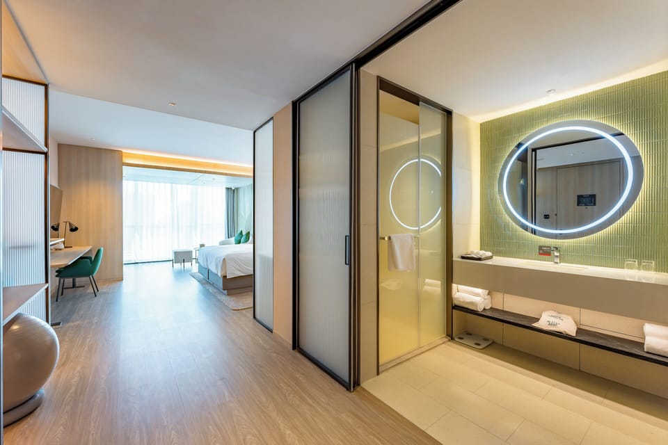 Premium Room, 1 King Bed (Smart Room, Living Area) | Bathroom | Shower, rainfall showerhead, hair dryer, slippers