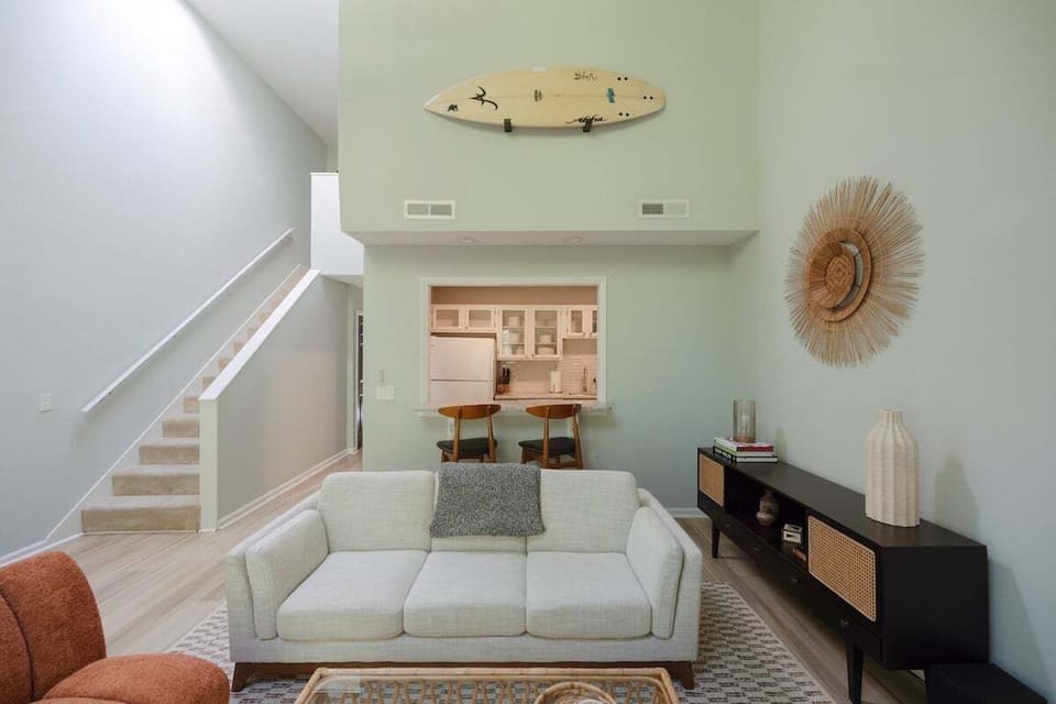 Relax in the coastal-inspired living area featuring airy décor and plenty of natural light.