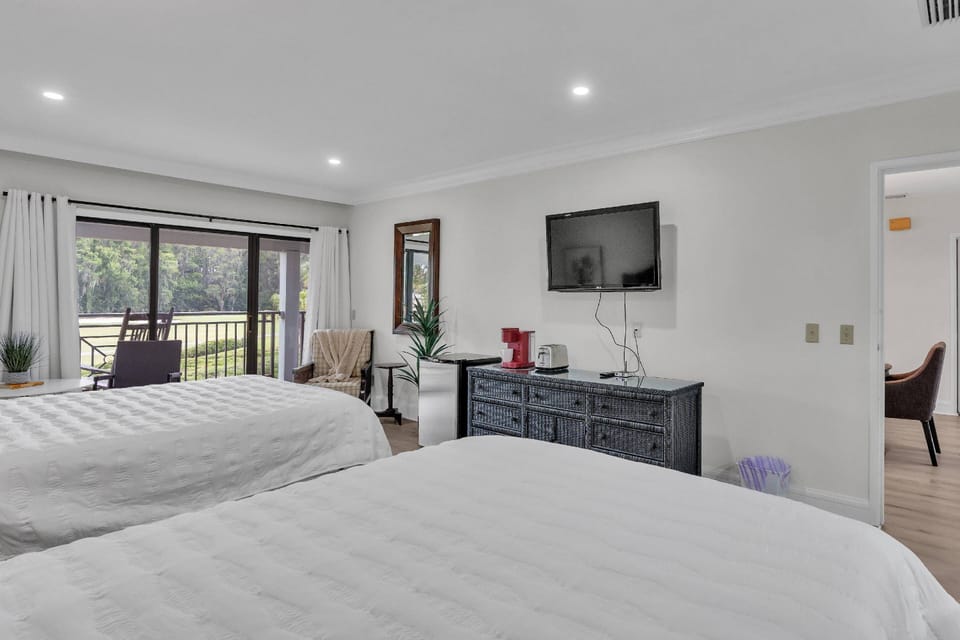 Studio with 2 Queen beds beckon in a cozy room equipped with a mini fridge, coffee maker, a toaster, and a TV!