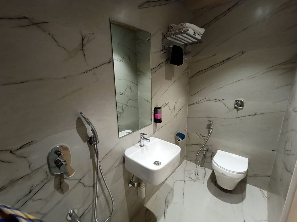 Superior Room | Bathroom | Shower, towels, toilet paper