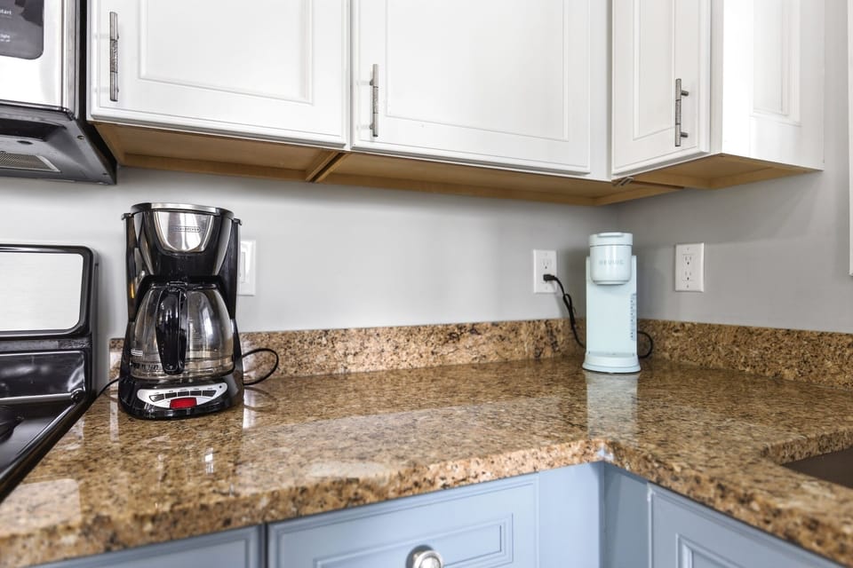 Fully equipped coffee station featuring a Keurig and drip coffee maker for easy mornings