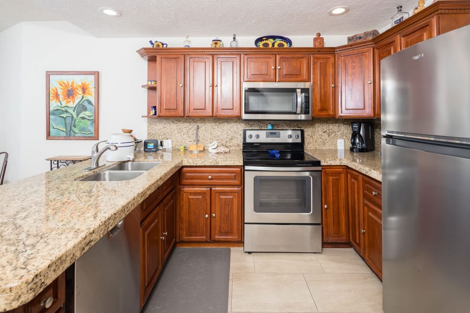  Everything you need to prepare meals or snacks—from cookware and appliances to a dining space with seating for the whole group.