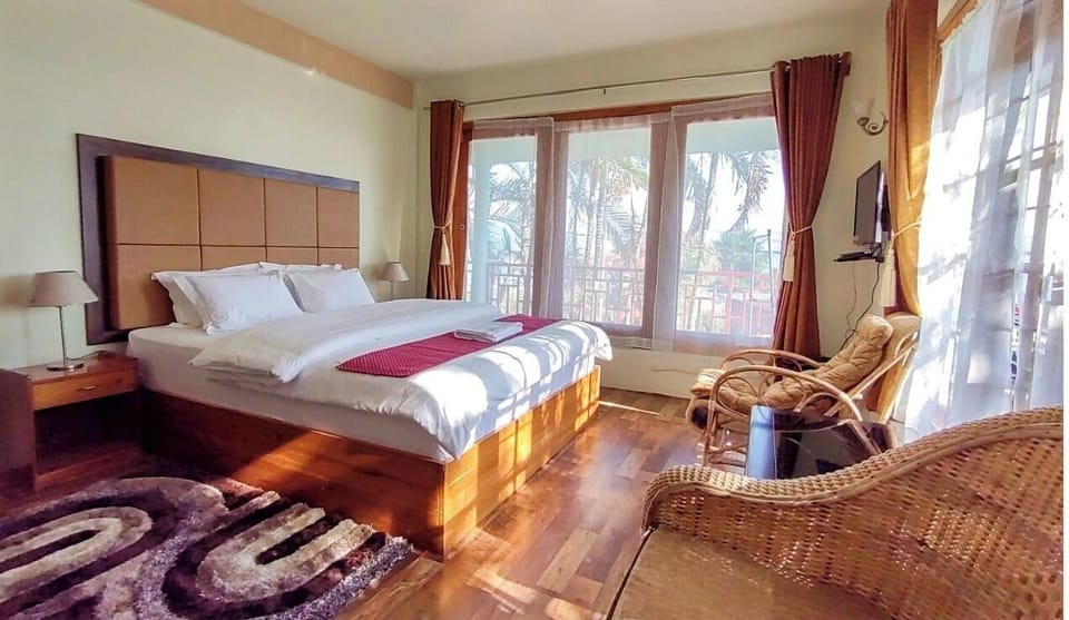 Premium bedding, desk, laptop workspace, iron/ironing board