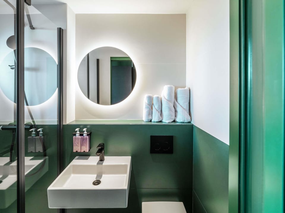 Shower, rainfall showerhead, hair dryer, towels