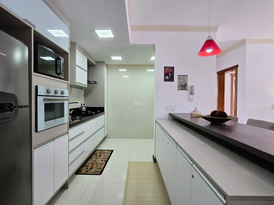 Traditional Apartment | Private kitchen | Full-size fridge, microwave, toaster oven, cookware/dishes/utensils