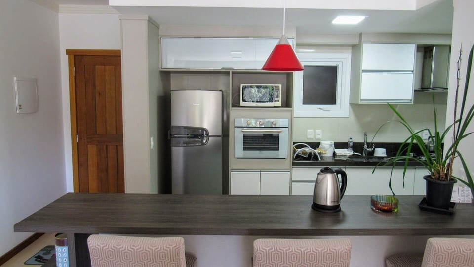Traditional Apartment | Private kitchen | Full-size fridge, microwave, toaster oven, cookware/dishes/utensils