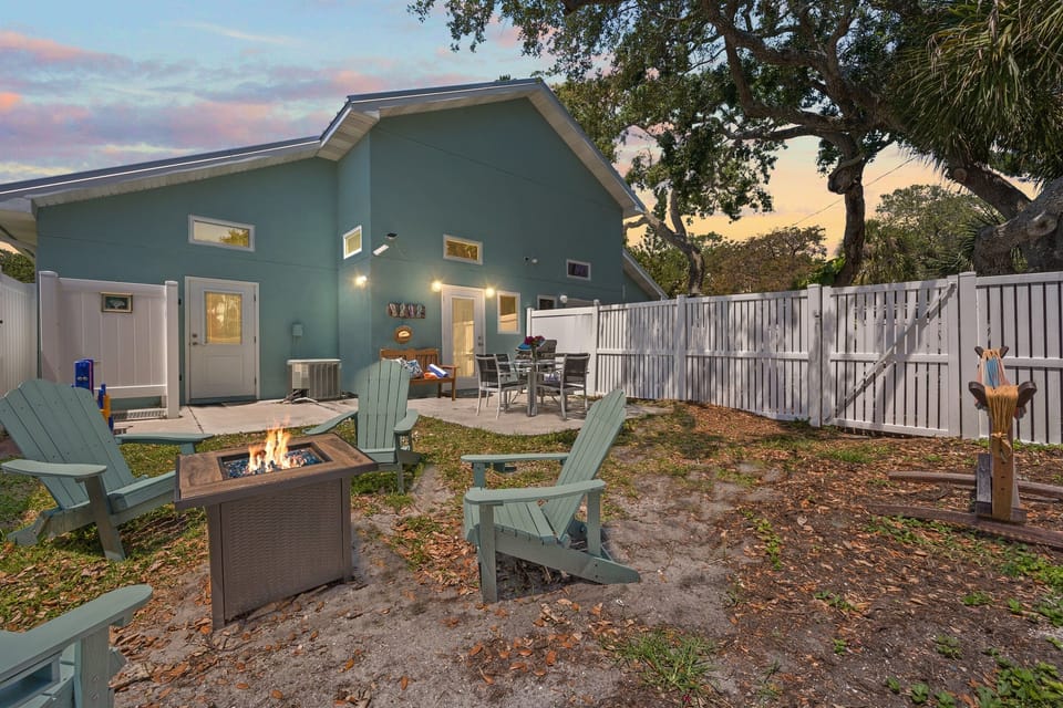 Outdoor Oasis: Gather around the fire pit or enjoy dinner in your private backyard retreat!