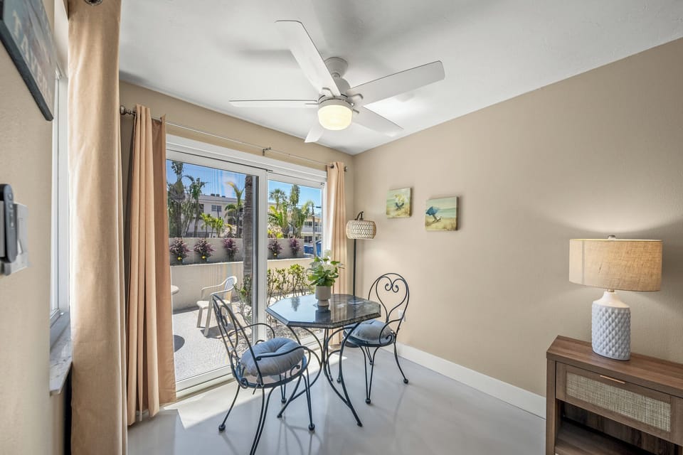 Bright design is accented by rays of sunlight bursting through the patio doors