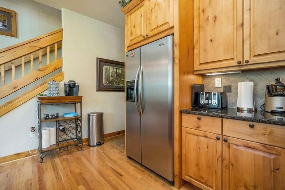 Elk River Cabin Side by side refrigerator in kitchen.
