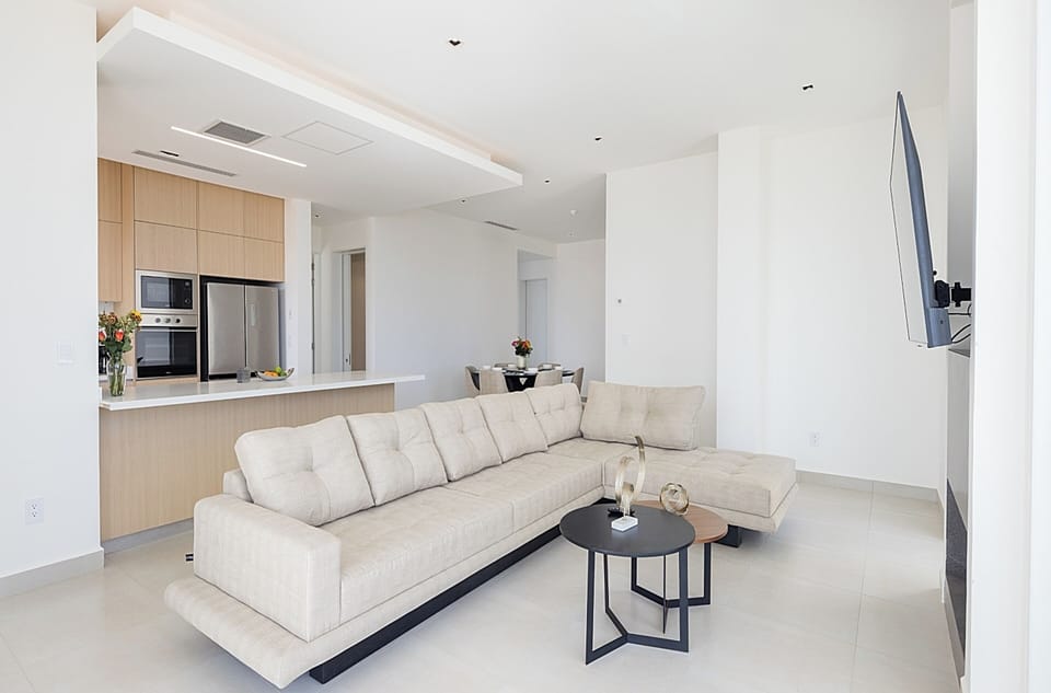Deluxe Condo, Sea View | Living area | Flat-screen TV