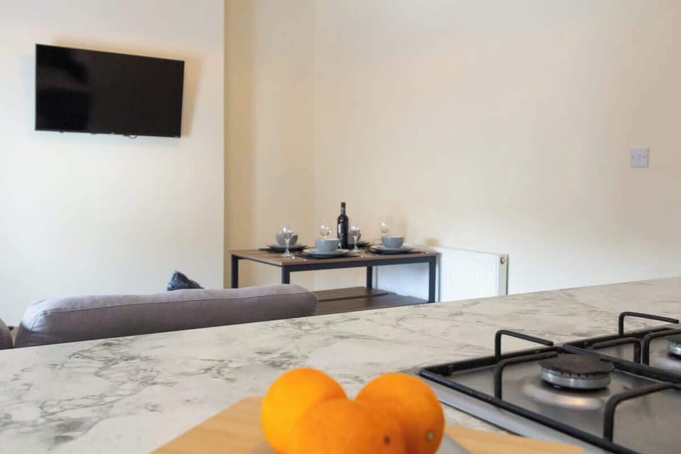 The living and dining space seamlessly blend together, providing a versatile area for relaxation and meals.