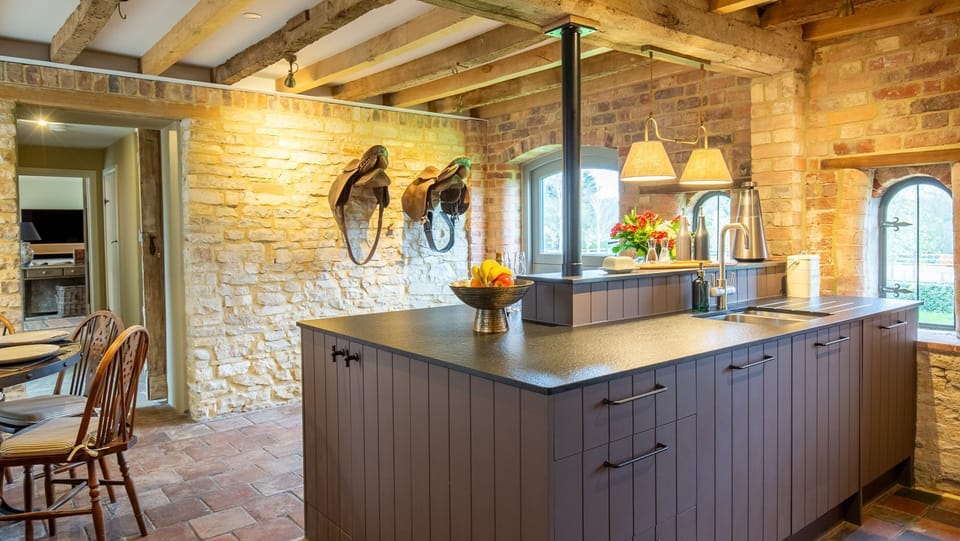A nod to its heritage, leather saddles hang from the wall in the Coach House