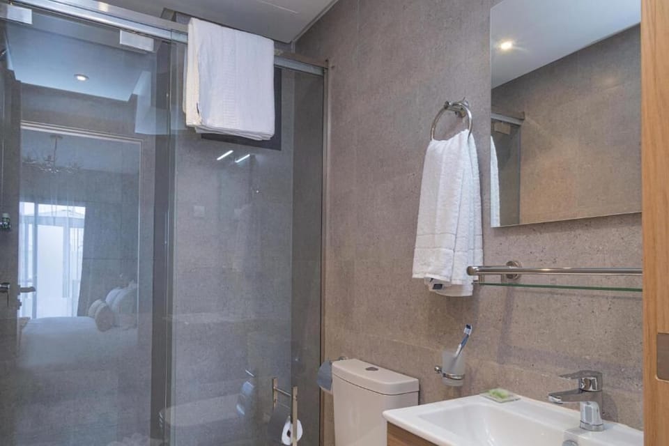 Shower, free toiletries, hair dryer, slippers