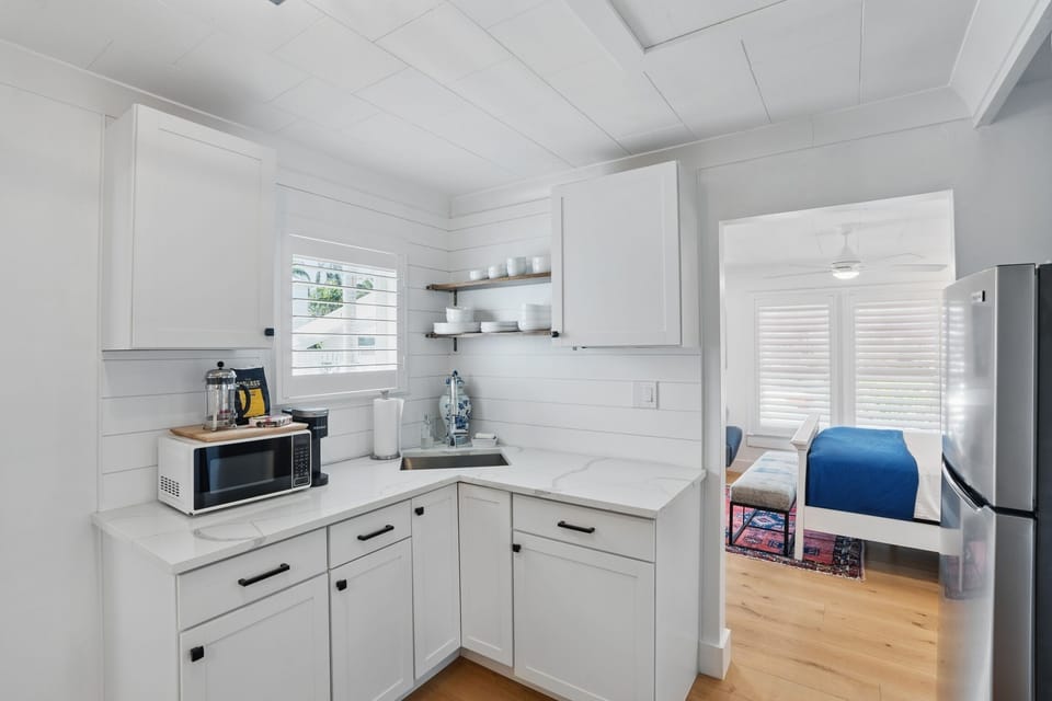 Kitchen has just a microwave, full fridge, an electric kettle and French Press. 