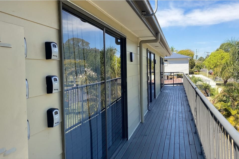 Balcony: Entrance balcony overlooking trees and greenery