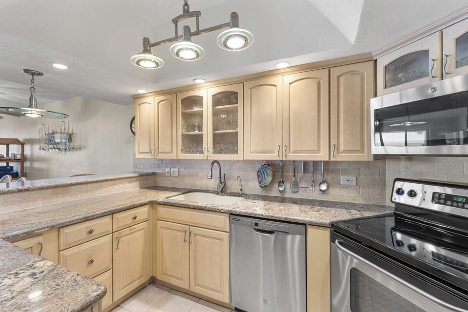 Kitchen with stainless steel appliances and granite counters