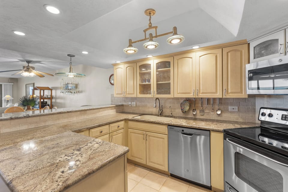 Kitchen with stainless steel appliances and granite counters