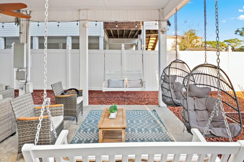 Enjoy ocean breezes from the spacious covered outdoor living area with lounge seating and firepit — a favorite hangout spot after the beach (No Grill).