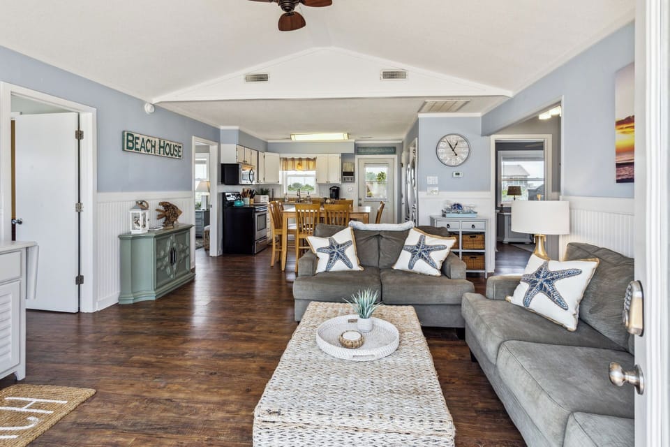 Relax in the spacious Living Area with views of the ocean and a Flat Screen TV for your comfort.