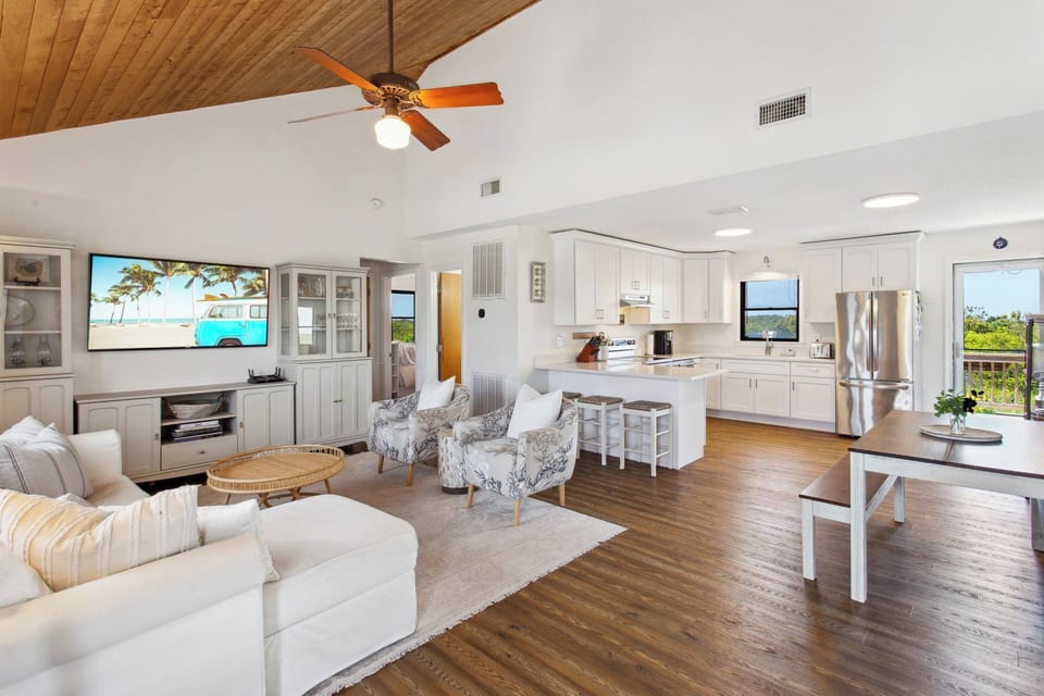 Relax in the beautiful Living Area with a Flat Screen TV and high ceilings!