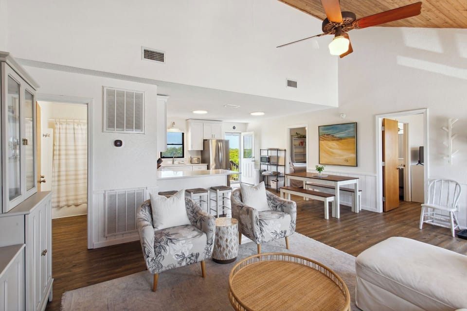 Relax in the beautiful Living Area with a Flat Screen TV and high ceilings!