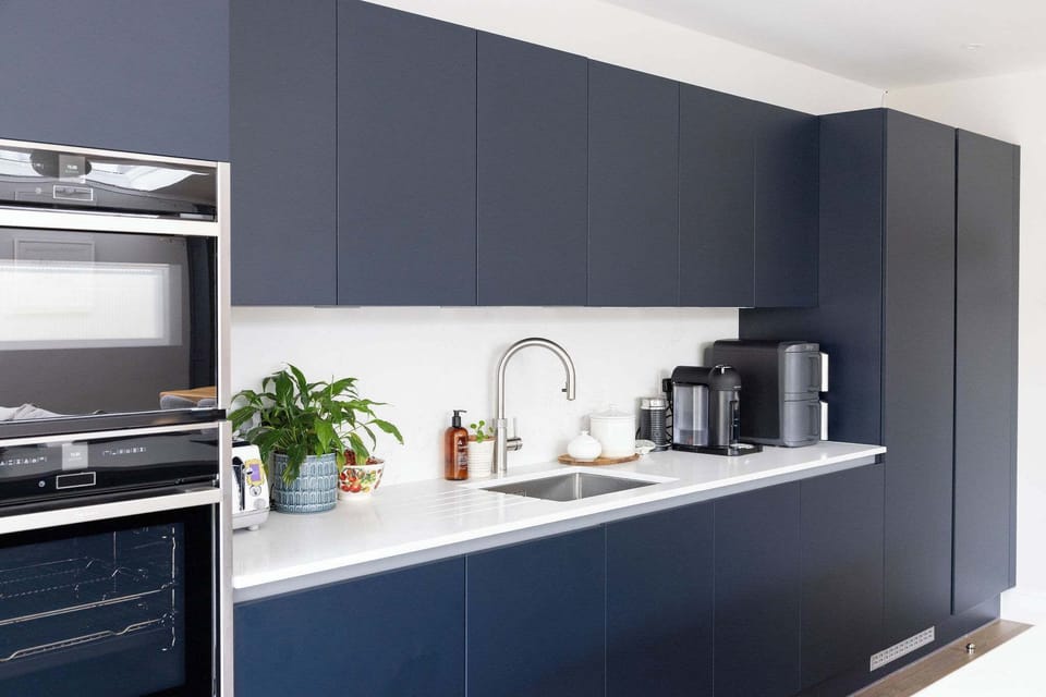 The modern kitchen is fully equipped with state-of-the-art appliances, spacious countertops and ample cabinetry for preparing and cooking.