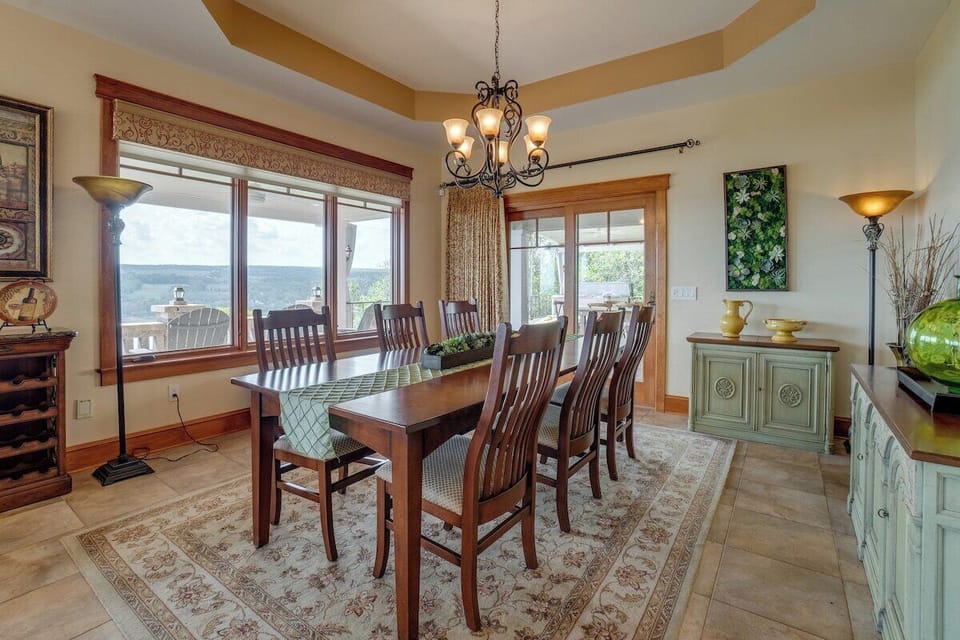 Dining area with doors to the huge outdoor pavilion and patio