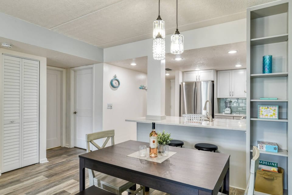 The dining table has plenty of space to share a meal together, including bar seating.