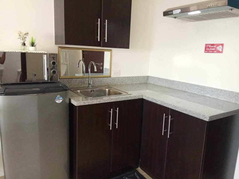Executive Condo, Pool View | Private kitchen | Fridge, stovetop, electric kettle, rice cooker