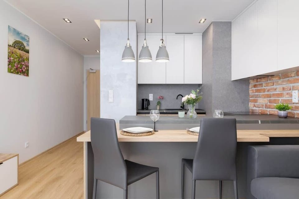 The modern kitchenette is equipped with all the necessary appliances, allowing you to prepare meals in comfort.
