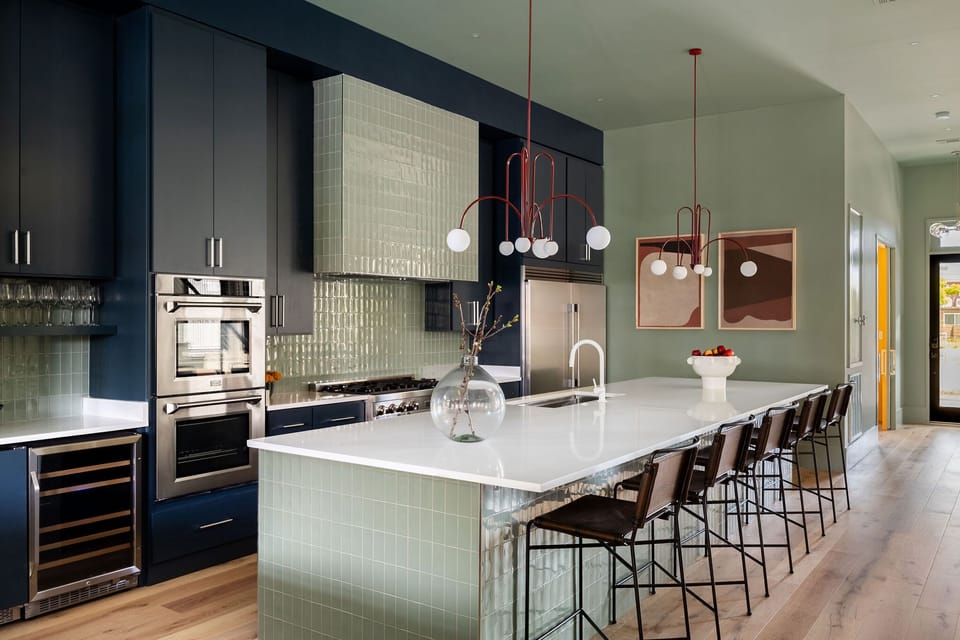 Kitchen | Fully Stocked Kitchen with Island and Bar Seating | First Floor