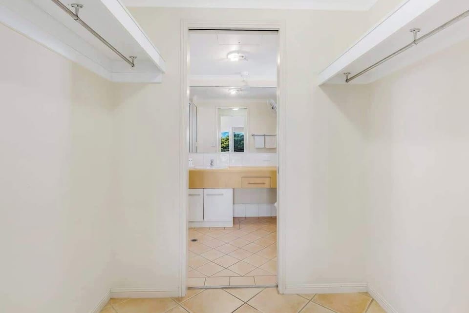 Providing plenty of space to hang your clothes and store your luggage, the first bedroom comes with a walk-in robe.