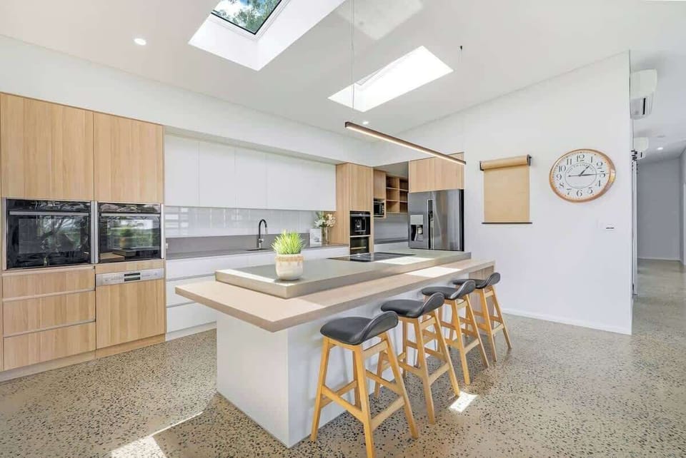 A modern chef’s kitchen designed for food lovers — complete with premium appliances, a butler’s pantry, and a large island for gathering.