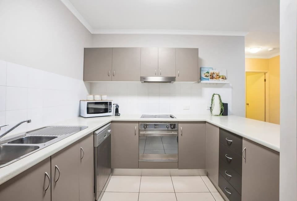 Preparing meals at home is easy with a well-equipped kitchen including a dishwasher for easy cleanup. 