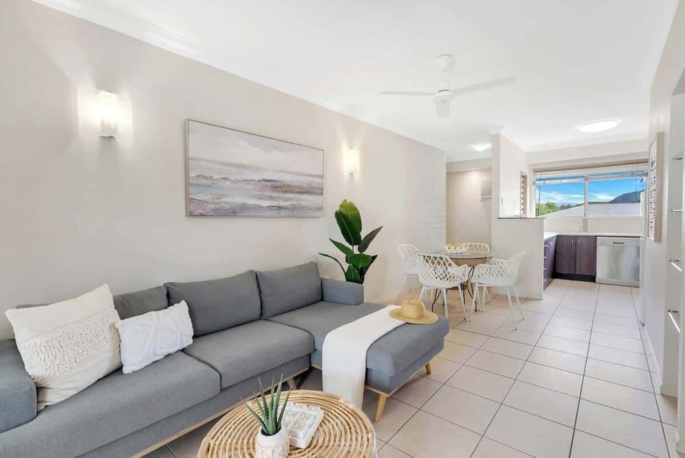 Relax in the chic and stylish living area, featuring an L-shaped lounge and TV for easy viewing.