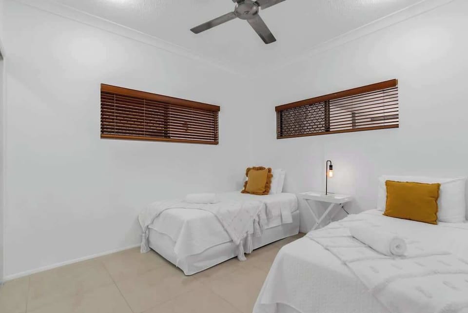 Ideal for families or friends, the third bedroom includes two single beds, providing a comfortable and relaxing space for all guests.