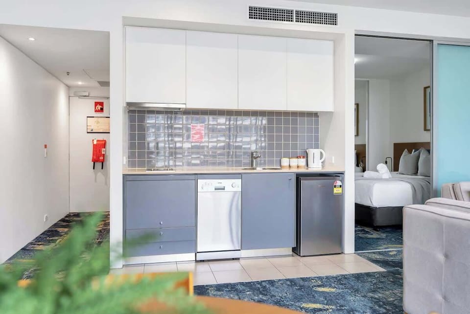 A kitchenette allows for a quick bite before hitting the building's shared gym and pool.