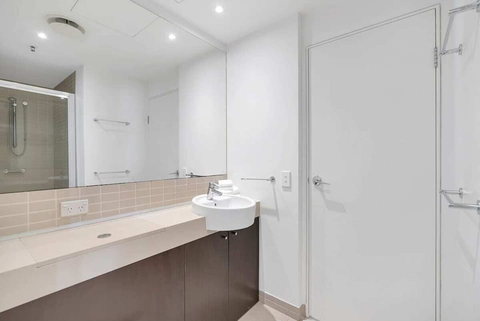 Freshen up in the modern bathroom, which includes a walk-in shower and stylish fixtures.
