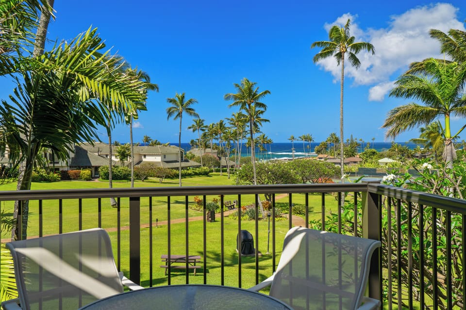 Step onto your private balcony and soak in sweeping views of lush tropical gardens and sparkling ocean beyond. Palm trees sway gently while you relax in paradise.