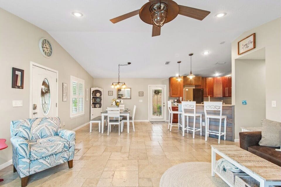 View of the dining room and kitchen. Access the side yard and back yard from the kitchen and the master bedroom.